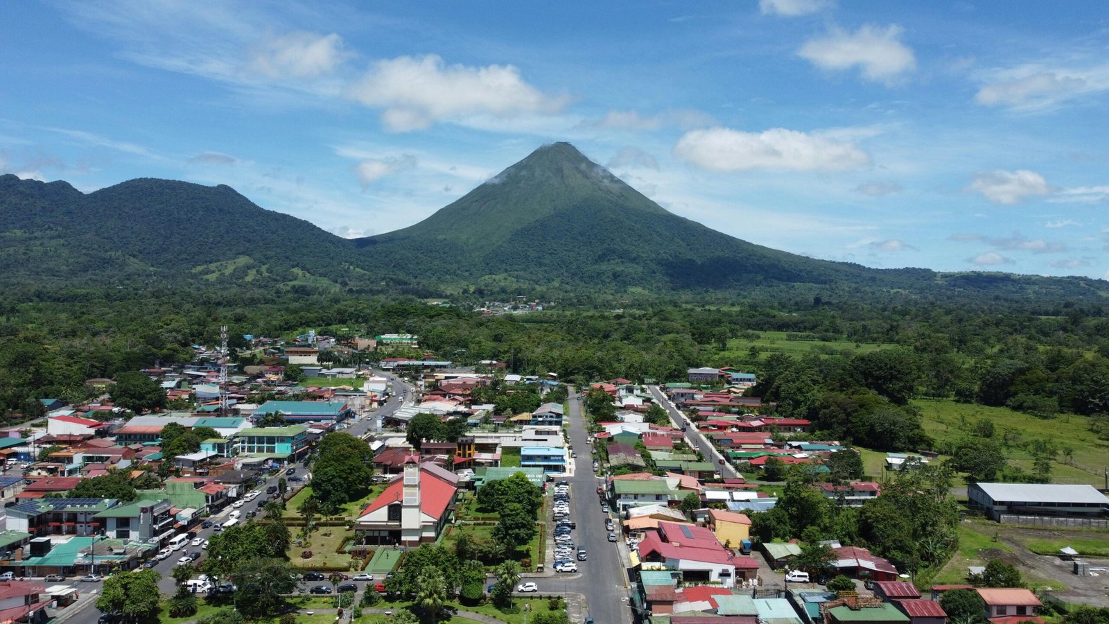 A breathtaking aerial view of La Fortuna with the majestic Arenal Volcano in Costa Rica.
